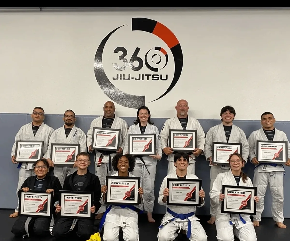 Black-belt coach demonstrating technique