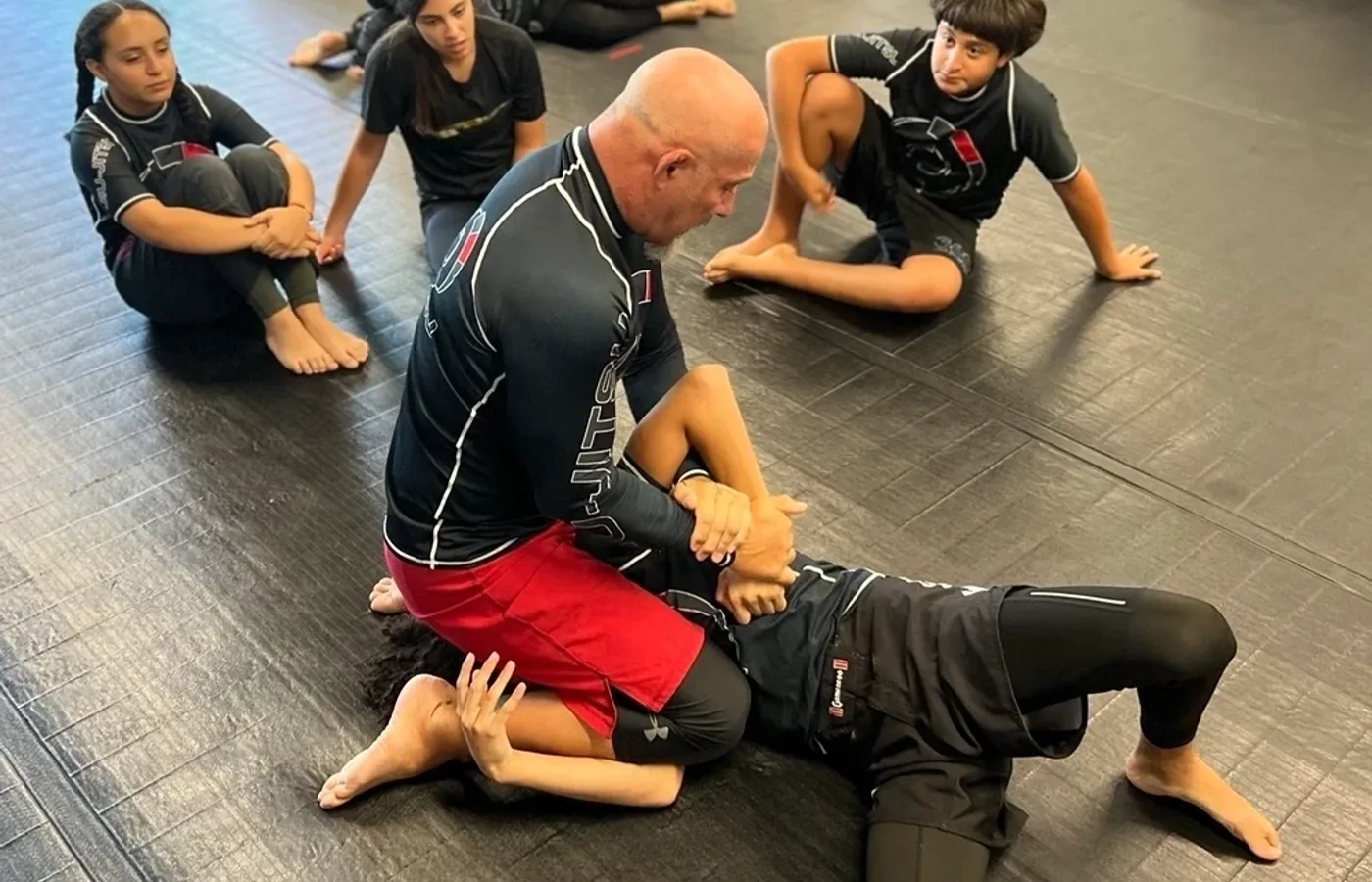 Coach demonstrating a position for the class